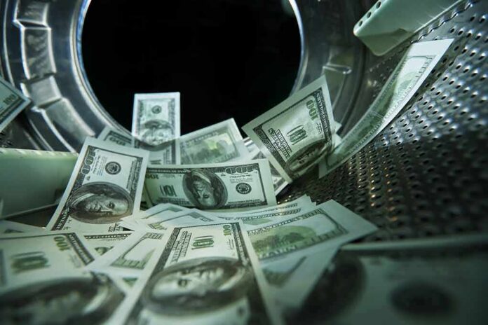 shutterstock_1709953360 US dollar bills inside a washing machine drum