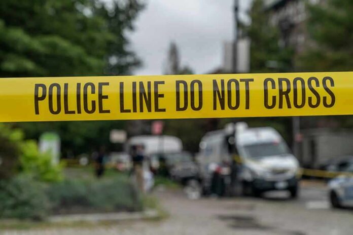 shutterstock_1797416719 yellow police tape cordoning off a street scene