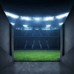 Stadium tunnel opening onto a brightly lit field
