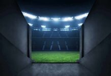 Stadium tunnel opening onto a brightly lit field