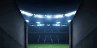 Stadium tunnel opening onto a brightly lit field
