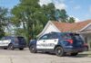 Two Toddlers Died After Weeks Of Welfare Checks Two police SUVs parked near a suburban house