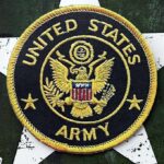 Military Families Targeted In $26M Grift United States Army embroidered patch on a green star background