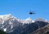 Freezing Cliff Trap on Shasta Helicopter flying over snow-capped mountain range