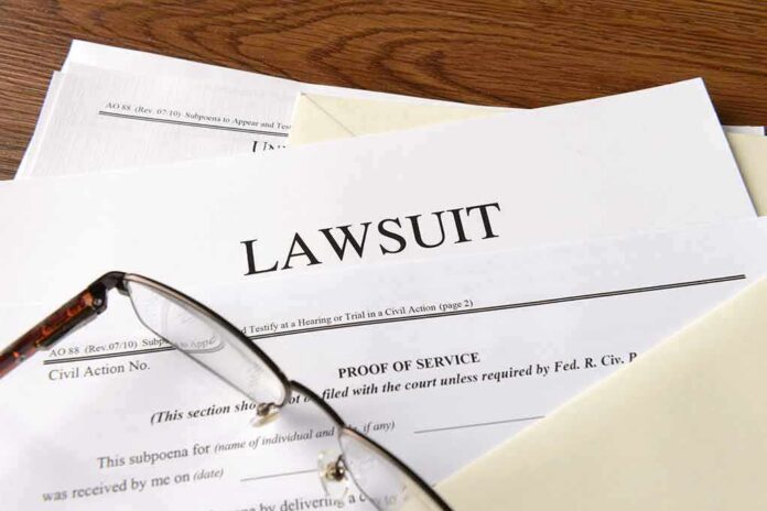 shutterstock_334984976-1 Legal documents labeled lawsuit on a desk