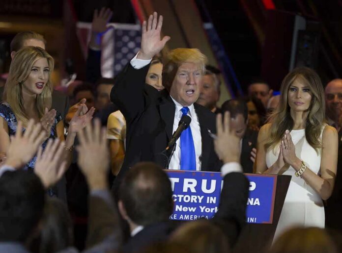 Donald Trump speaks at a rally with Ivanka Trump and Melania Trump on stage; Karlie Kloss in the crowd