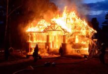 System Failures Fueled Palisades Chaos house engulfed in flames at night