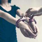 Houston Custody Clash Ends In Blood Person being handcuffed with hands extended forward